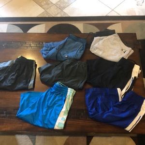 7 pairs of Nike and Under Armour shorts size large